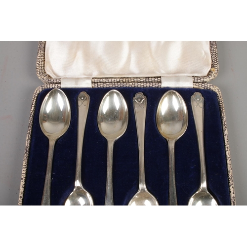 375 - A cased set of silver Walker & Hall tea spoons featuring golfing decoration to handle. Assayed Chest... 