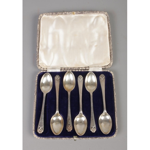 377 - A cased set of silver Walker & Hall tea spoons featuring golfing decoration to handle. Assayed Sheff... 