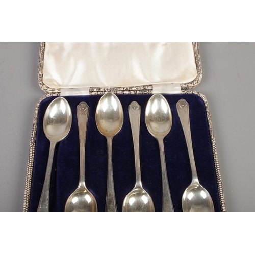 377 - A cased set of silver Walker & Hall tea spoons featuring golfing decoration to handle. Assayed Sheff... 