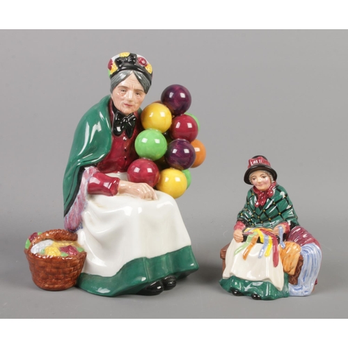 385 - Two Royal Doulton figures; The Old Balloon Seller HN1315 and Silks and Ribbons HN4808.