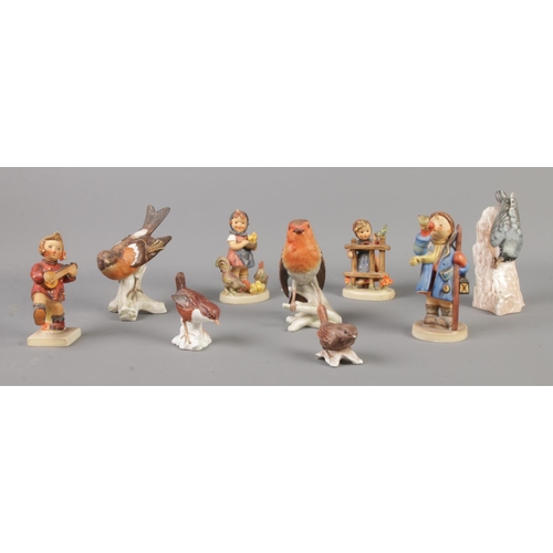 393 - A collection of Goebel ceramic birds and figures, including 'Happiness' and 'Hear Ye, Hear Ye'.