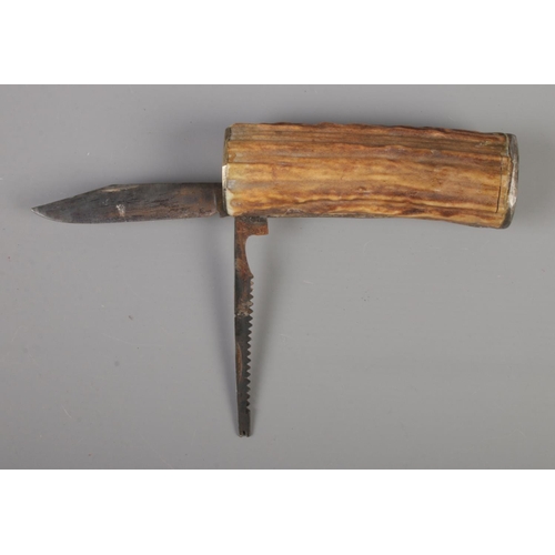 395 - A large horn bodied multi bladed knife, with one serrated blade. Stamped G-W-P to one end. CAN NOT P... 