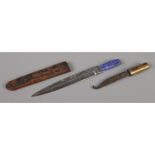 396 - A WWII W-S 1941 fighting knife in part scabbard, together with a trench art fishing net mending knif... 