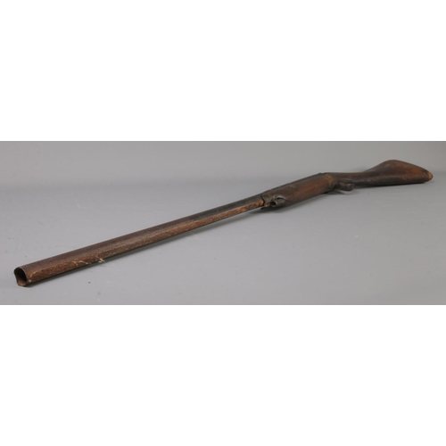 397 - Two Nineteenth Century percussion cap pit rifles; including Eastern example with bone inlay to the h... 