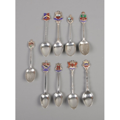 400 - Nine Birmingham silver souvenir spoons. Total weight 110g.