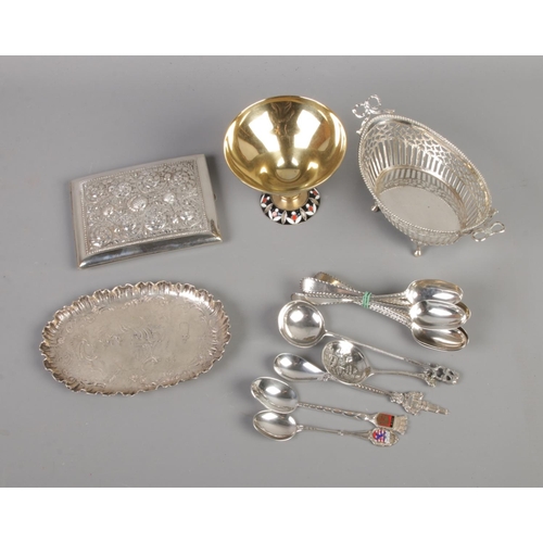 403 - A collection of continental silver items including spoons, serving basket, tray, etc. Also includes ... 