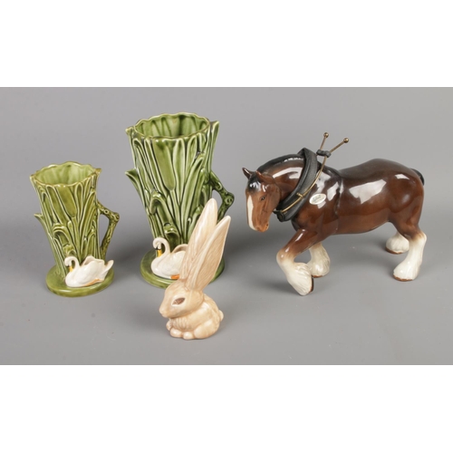 404 - A collection of Sylvac ceramics including shire horse, rabbit and two swan vases.