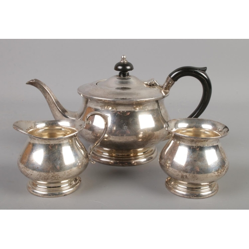 405 - A silver three piece tea set. Assayed Birmingham 1971 by Bishton's Ltd. 546g.