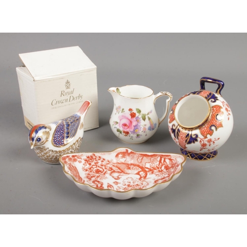 407 - Four pieces of Royal Crown Derby bone china. Includes salt pot, Goldcrest paperweight, cream jug and... 