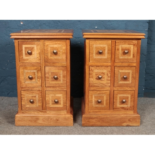 418 - A pair of modern bedside drawers featuring six drawers, inlay decoration to top and drawers. Approx.... 