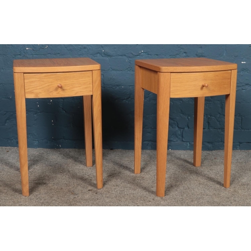 420 - A pair of modern bedside tables featuring soft-close single drawer raised on tapered legs.