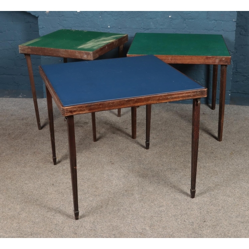 427 - Three folding card tables including two felt topped examples.