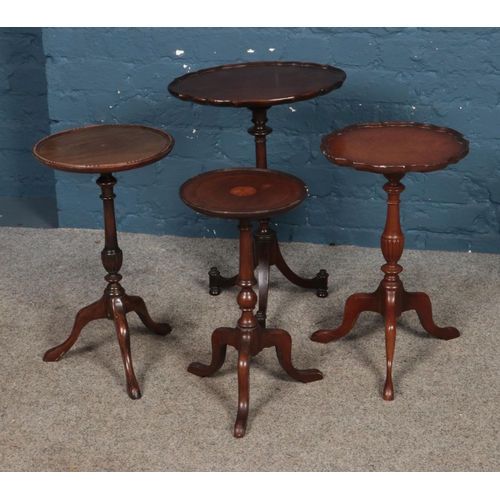 430 - A collection of four wine tables.