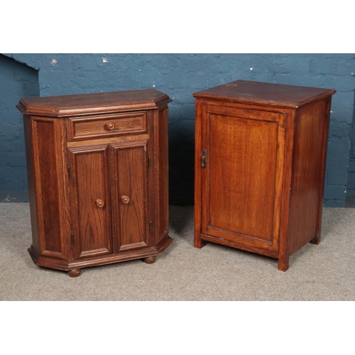 433 - An oak cupboard along with an oak side cabinet with drawer.