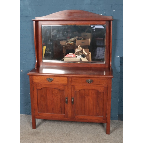 441 - A mahogany bevel edged mirror back sideboard, with arched top and two drawers over cupboard base. He... 