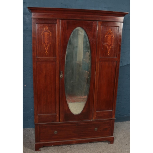 442 - An Edwardian inlaid mahogany mirror front wardrobe. (198cm x 131cm)