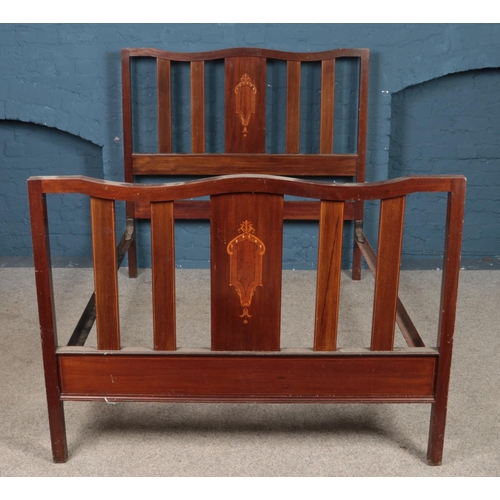 447 - An Edwardian mahogany double bed frame, with inlay decoration to headboard and footboard. Height: 13... 