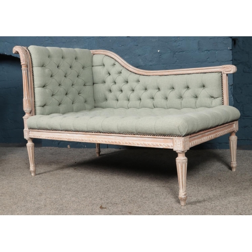 455 - A French chalked corner sofa/chaise lounge of small proportion, with heavily carved detailing and sc... 