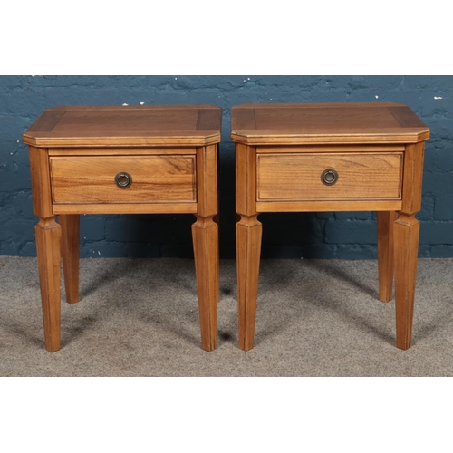 465 - A pair of hardwood bedside tables with single drawers.