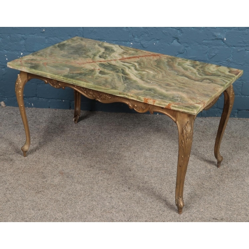 467 - A marble top and gilt metal coffee table. (46cm x 85cm x 50cm)