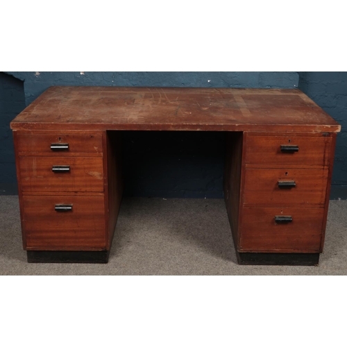 473 - A large teak twin pedestal desk. (73cm x 153cm)