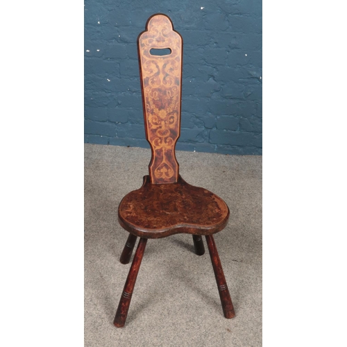 488 - An inlaid hardwood spinning chair. Raised on four turned supports.