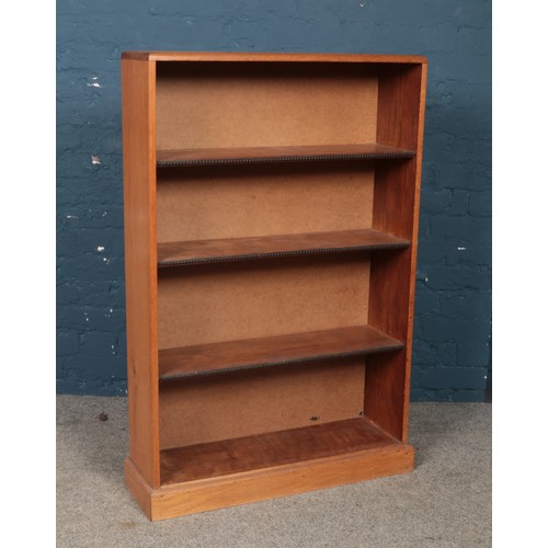 416 - A carved oak open bookcase. (117cm x 76cm x 24cm)