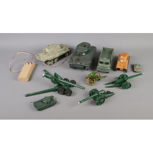 211 - A quantity of military themed diecast and remote control toys. To include Tamiya remote control tank... 