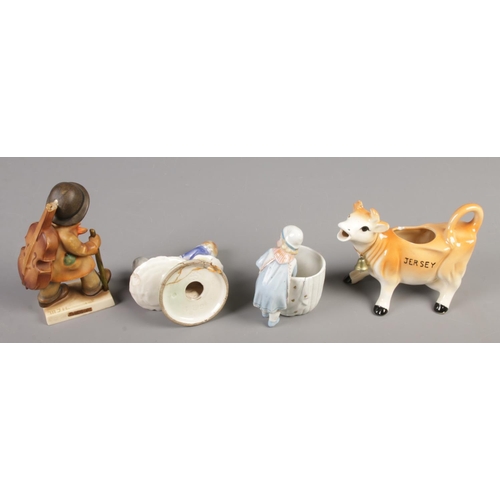 114 - A large quantity of ceramic figures and figure groups, including several Goebel and Beswick examples... 