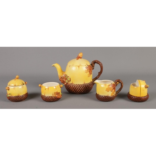 12 - A Burleigh ware five piece oak and acorn part tea set. Includes teapot, cream jug and condiment set.