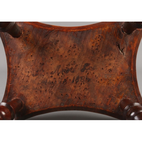 154 - A Victorian burr walnut miniature stool with turned supports, engraved 1884 to underside along with ... 