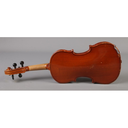 17 - A cased violin. Label for Sweet Tone, Shanghai, China. 11inch back.