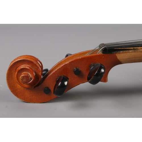 17 - A cased violin. Label for Sweet Tone, Shanghai, China. 11inch back.