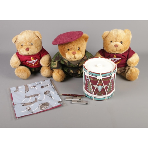 21 - A collection of Parachute Regiment memorabilia including novelty drum ice bucket, teddy bears and li... 