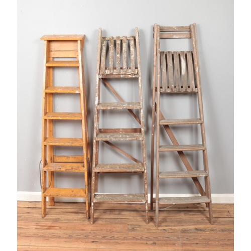 254 - Three set of wooden ladders.