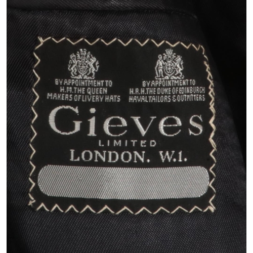 262 - A Royal Navy Lieutenants jacket. Bearing label for Gieves Limited, London.