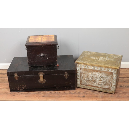 265 - A tin trunk along with two ash boxes including decorative brass example.