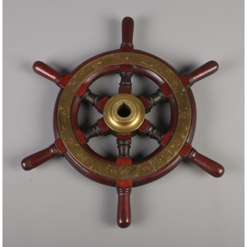51 - A brass mounted six spoke boat wheel. Approx. diameter 41cm.
