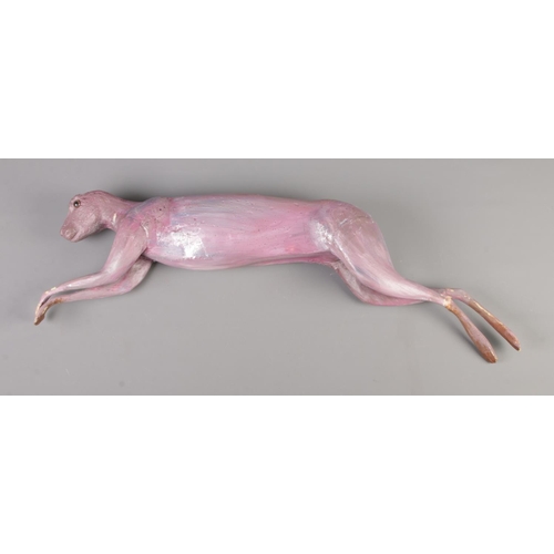 56 - A fibreglass model formed as a skinned hare without ears.