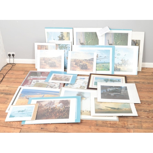 276 - A very large quantity of military themed prints including D-Day Airbourne, Arnhem and Canadian Airbo... 