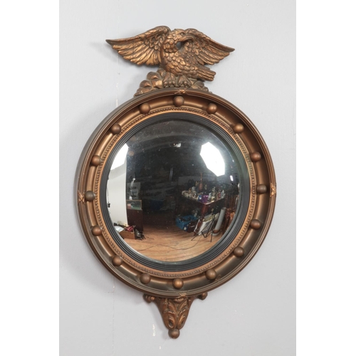 293 - An Atsonea Regency style convex mirror surmounted with an eagle.