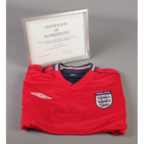 61 - An England football shirt signed by Michael Owen, with certificate of authenticity.