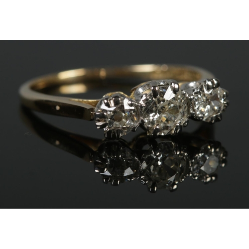 328 - An 18ct Gold and Platinum three stone diamond ring. Largest stone over ¼ct, with a diameter of 5mm. ... 