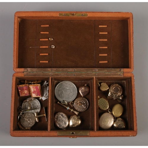 330 - A brown hinged box containing an assortment of yellow metal jewellery. Includes 9ct Gold front and b... 