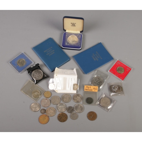 70 - A tin of British pre decimal and world coins. Includes silver 10 Rupees coin, Seychelles 1974, two I... 