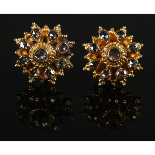 355 - A pair of yellow gold and black diamond ear studs. Test to 22ct Gold. Total weight: 2.5g.