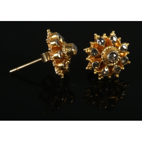 355 - A pair of yellow gold and black diamond ear studs. Test to 22ct Gold. Total weight: 2.5g.