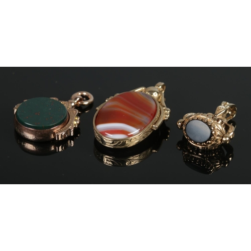 357 - Three 9ct Gold swivel fobs, including agate and blood stone examples. Total weight: 23.0g.