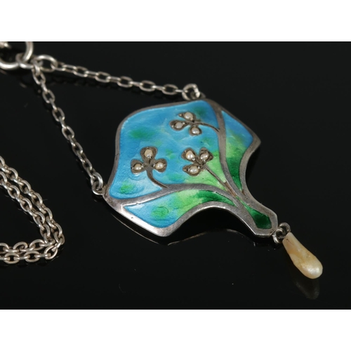 358 - An art nouveau silver, enamel and pearl pendant on chain.