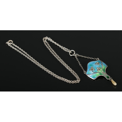 358 - An art nouveau silver, enamel and pearl pendant on chain.